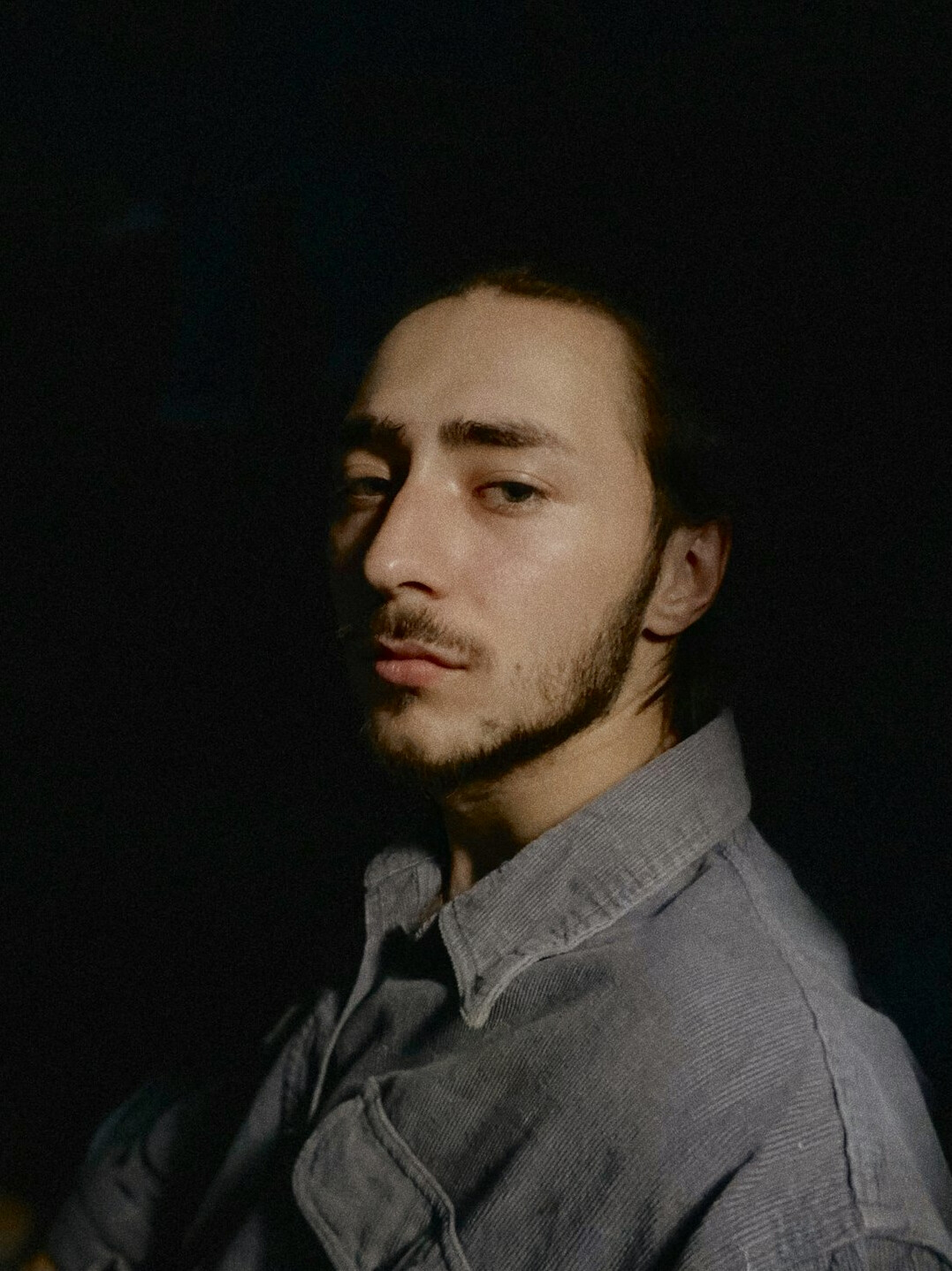 Portrait of a bearded man in a casual shirt